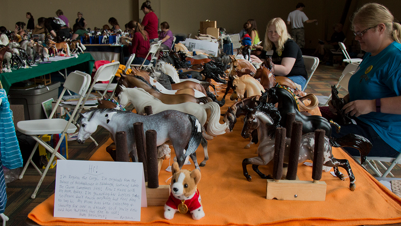 All Photo: Bryan Menegus/Gizmodo. A table of several model horse collections, ready for Friday’s live show.